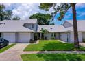Inviting home featuring lush landscaping and a convenient driveway, perfect for comfortable living at 955 Grayling Ct # B, Port Orange, FL 32127