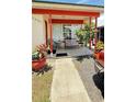 Inviting front porch with comfortable seating and potted plants, perfect for relaxing at 1025 Persian St, Deltona, FL 32725