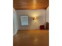 Room with a wood ceiling, large window, and accent lighting at 110 Amigos Rd, Debary, FL 32713