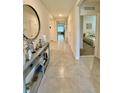 Bright entryway with ceramic tile flooring, high ceilings, and an ornate console table, perfect for a welcoming ambiance at 1216 August Sky Dr, Deltona, FL 32738