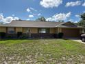 Charming single-story home featuring a well-maintained lawn and attached two-car garage at 1887 Viking Ave, Deltona, FL 32725