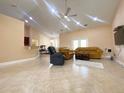 Bright living room boasts tile floors, ample seating, and an open layout, perfect for entertaining guests at 19320 Oberly Pkwy, Orlando, FL 32833