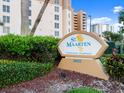 Welcoming entrance sign for St. Maarten Condominium Residences, set amidst lush landscaping with clear signage at 2403 S Atlantic Ave # 410, Daytona Beach, FL 32118