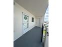 Outdoor balcony featuring a storm door, window, and railing at 2860 Ocean Shore Blvd # 5020, Ormond Beach, FL 32176