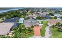 Aerial shot showcases the home's waterfront location, landscaping, and proximity to water at 3 Sea Dance Ter, Ormond Beach, FL 32176