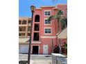 Exterior view of the condos showcasing a well-maintained building and convenient garage access at 424 Luna Bella Ln # 330, New Smyrna Beach, FL 32168