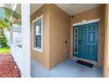 Covered entryway with blue door and welcome mat at 452 Casa Marina Pl, Sanford, FL 32771