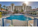 Resort-style pool area perfect for relaxation and entertainment, featuring cozy cabanas at 5300 S Atlantic Ave # 12-401, New Smyrna Beach, FL 32169