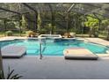 Beautiful in-ground pool and hot tub with the convenience of a screened enclosure at 6211 Oak River Ter, Port Orange, FL 32127
