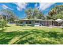 A charming single-story home with a well-maintained lawn and mature trees, in a serene setting at 626 Cannon St, Daytona Beach, FL 32114