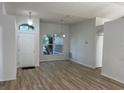 Bright living room with hardwood floors and a large window at 1693 Arash Cir, Port Orange, FL 32128