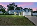 Well-maintained single-Gathering home with a beautiful lawn, perfect for families or anyone looking for a tranquil setting at 2237 Clearwater Dr, Deltona, FL 32738
