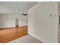 Spacious living room featuring wood-look tile flooring, providing a stylish and low-maintenance living space at 2237 Clearwater Dr, Deltona, FL 32738