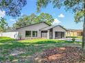 Landscaped front yard and well-kept exterior showcasing the home's curb appeal and inviting atmosphere at 28432 Tammi Dr, Tavares, FL 32778
