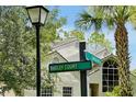 Street sign view showing lush greenery, the exterior of the property, and the neighborhood street names at 3988 Radley Ct, Longwood, FL 32779