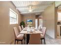 Cozy dining room with seating for six, featuring bright natural light and stylish decor at 442 Dorothy Ave, Daytona Beach, FL 32117