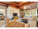 Inviting living room featuring vaulted wood ceilings and comfortable seating area with natural light at 442 Dorothy Ave, Daytona Beach, FL 32117