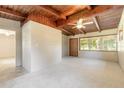 Spacious living area with wood ceiling, large windows and neutral carpet flooring at 442 Dorothy Ave, Daytona Beach, FL 32117
