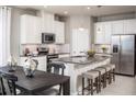 Modern kitchen with stainless steel appliances and island at 2175 Aibonito Cir, Clermont, FL 34711