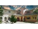 Two-story house with an outdoor sitting area and green trees at 4920 Sw 78Th Ave, Bushnell, FL 33513