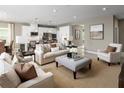 Open concept living room and kitchen with neutral decor and ample natural light at 746 Copper Creek Dr, New Smyrna Beach, FL 32168