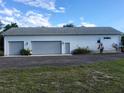Spacious three car garage with ample parking and storage at 2719 Brookline Ave, New Smyrna Beach, FL 32168