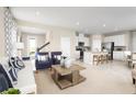 Open floor plan connecting living room and kitchen with modern finishes at 3025 Ruby Falls Dr, Deland, FL 32724