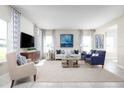 Bright living room with comfy seating, large windows, and stylish decor at 3025 Ruby Falls Dr, Deland, FL 32724