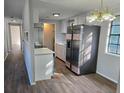 Modern kitchen with stainless steel appliances and laminate flooring at 5840 Nw 16Th St, Ocala, FL 34482