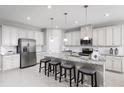 Modern kitchen with stainless steel appliances and granite countertops at 1912 Quail Fields Cir, Winter Haven, FL 33884
