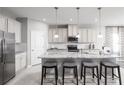 Modern kitchen with granite countertops and stainless steel appliances at 1912 Quail Fields Cir, Winter Haven, FL 33884