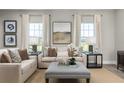Living room featuring a comfy sofa, large windows, and neutral decor at 3744 Sky Mountain Aly, Apopka, FL 32712