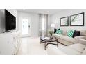 Light and airy living room with neutral colored furniture at 281 Tahiti Rd, Lady Lake, FL 32159
