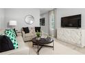 Living room with comfortable seating and stylish decor at 281 Tahiti Rd, Lady Lake, FL 32159