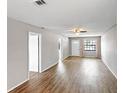 Spacious living room with wood-look floors and neutral walls at 801 Egret Ct, Edgewater, FL 32141