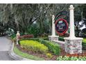 Sullivan Ranch community entrance sign surrounded by mature trees and manicured landscaping in Mount Dora, Florida at 22004 Belgian Ct, Mount Dora, FL 32757