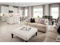 Open concept kitchen with white cabinets and an island at 7405 Sw 108Th St, Ocala, FL 34476