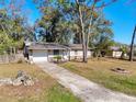 Bright kitchen with dining area, stainless steel appliances and access to the backyard through sliding glass doors at 1531 Ne 38Th St, Ocala, FL 34479