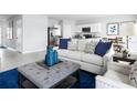 Bright living room featuring stylish furniture and an open-concept design at 355 Biltmore Blvd, Dundee, FL 33838