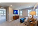 Open concept living room with neutral carpet, ample natural light, and modern decor at 678 Four Leaf Ave, Debary, FL 32713