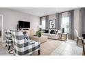 Inviting living area with plush seating, contemporary design, and ample natural light at 1314 Whispering Ln, Minneola, FL 34715