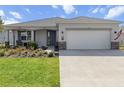 Charming single-story home with a well-manicured lawn and a spacious two-car garage at 8750 Sw 79Th Loop, Ocala, FL 34481
