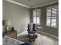 Sitting area in main bedroom features two large windows with wood flooring at 1425 Ocean Shore Blvd # 402, Ormond Beach, FL 32176