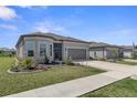 Charming home with stone accents, well-kept lawn, and a two-car garage in a residential neighborhood at 8534 Sw 59Th Lane Rd, Ocala, FL 34481