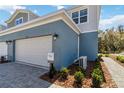 This townhome has a two-car garage and manicured landscaping at 5228 Luisa Ct, St Cloud, FL 34771
