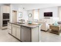 Modern kitchen featuring stainless steel appliances, granite countertops, and an open layout at 5012 Bear Lake Loop, Deland, FL 32724
