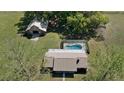 A captivating aerial view of the property, featuring a barn, pool, home and lots of land at 3815 Se 25Th St, Bushnell, FL 33513