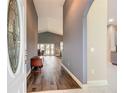 Inviting foyer leads to a spacious living area with hardwood floors and plenty of natural light at 4649 Sw 103Rd Street Rd, Ocala, FL 34476