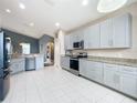 Spacious kitchen features stainless steel appliances, granite countertops, and ample cabinet space at 4649 Sw 103Rd Street Rd, Ocala, FL 34476