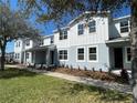 Charming two-story townhome with a well-manicured lawn and beautiful landscaping, perfect for comfortable living at 3309 Grande Heron Dr, St Cloud, FL 34773